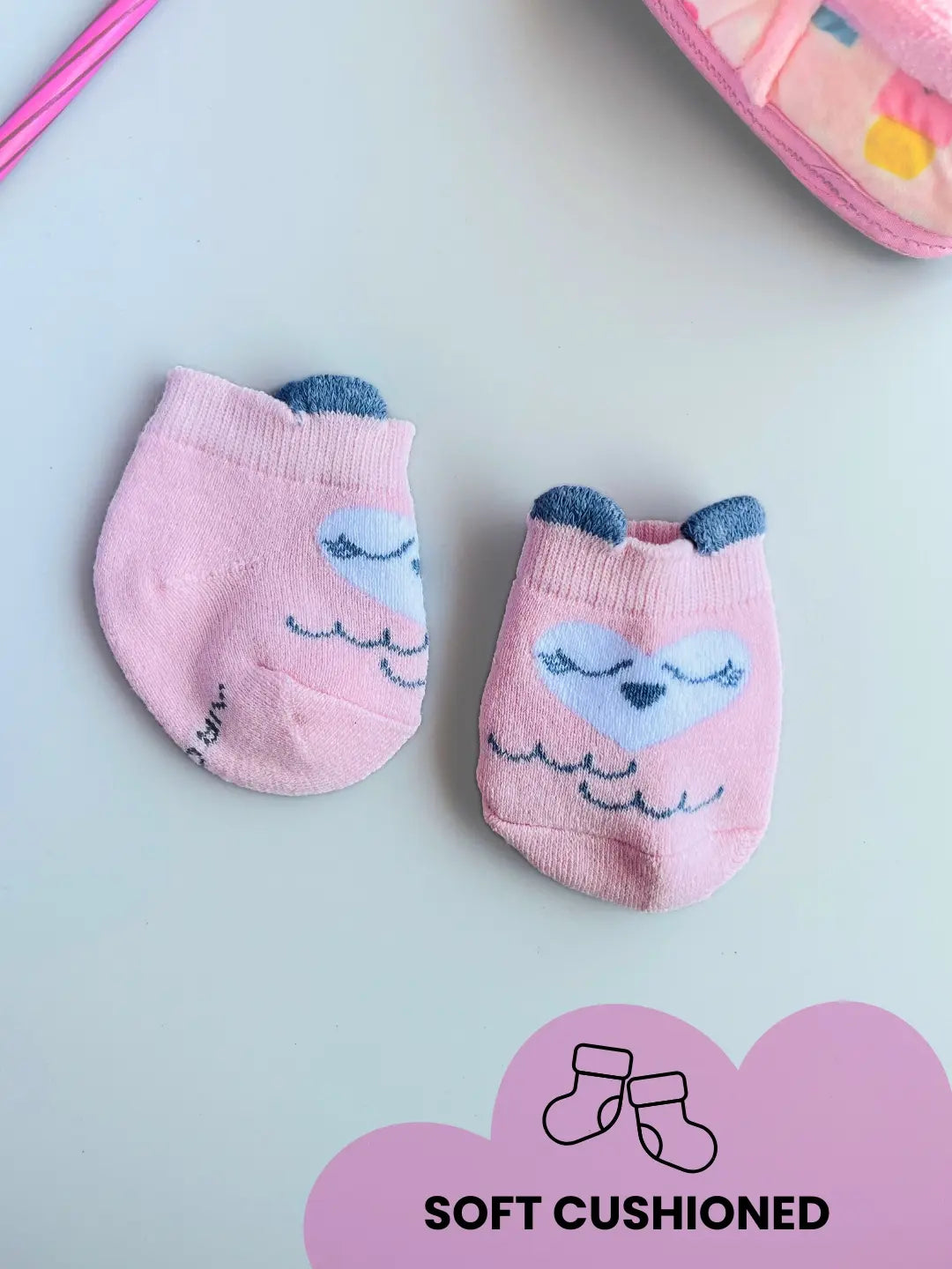 Air Garb baby combo socks for infants 0-1 years; a 6-pair collection arranged in a circle featuring animal faces like pink owl, brown giraffe, and white dog, alongside kitten-themed socks in purple, lime green, and blue.