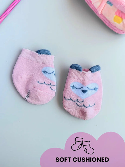 Air Garb baby combo socks for infants 0-1 years; a 6-pair collection arranged in a circle featuring animal faces like pink owl, brown giraffe, and white dog, alongside kitten-themed socks in purple, lime green, and blue.